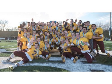 The LeBoldus Golden Suns celebrate their victory over the Holy Cross Crusaders during the High school football 4A provincial final at SMS field in Saskatoon, SK. on Saturday, November 12, 2016. (LIAM RICHARDS/THE STAR PHOENIX)