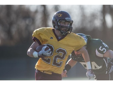 LeBoldus Golden Suns half back Zachary Moore runs the ball against the Holy Croos Crusaders during the High school football 4A provincial final at SMS field in Saskatoon, SK. on Saturday, November 12, 2016. (LIAM RICHARDS/THE STAR PHOENIX)