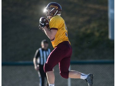 LeBoldus Golden Suns offensive linemen Ryder Varga grabs a pass for a touchdown against the Holy Cross Crusaders during the High school football 4A provincial final at SMS field in Saskatoon, SK. on Saturday, November 12, 2016. (LIAM RICHARDS/THE STAR PHOENIX)