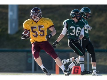 LeBoldus Golden Suns offensive linemen Ryder Varga grabs a pass for a touchdown against the Holy Cross Crusaders during the High school football 4A provincial final at SMS field in Saskatoon, SK. on Saturday, November 12, 2016. (LIAM RICHARDS/THE STAR PHOENIX)