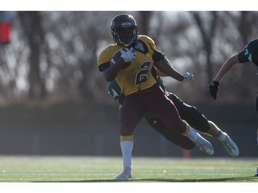 LeBoldus Golden Suns running back Semba Mbasela runs the ball against the Holy Cross Crusaders during the High school football 4A provincial final at SMS field in Saskatoon, SK. on Saturday, November 12, 2016. (LIAM RICHARDS/THE STAR PHOENIX)