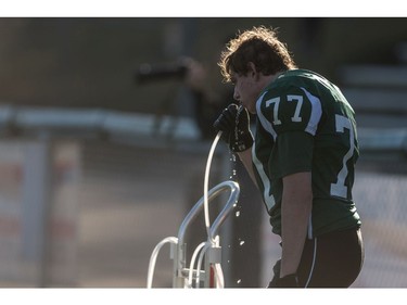 Holy Cross Crusaders defensive linemen Mike Kaulback gets some water as his teams takes on the  LeBoldus Golden Suns during the High school football 4A provincial final at SMS field in Saskatoon, SK. on Saturday, November 12, 2016. (LIAM RICHARDS/THE STAR PHOENIX)