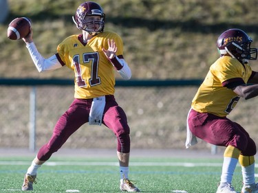 LeBoldus Golden Suns quarterback Josh Donnelly throws a pass against the Holy Cross Crusaders during the high school football 4A provincial final at SMS field in Saskatoon, November 12, 2016.