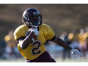 LeBoldus Golden Suns running back Semba Mbasela runs the ball against the Holy Cross Crusaders during the High school football 4A provincial final at SMS field in Saskatoon, SK. on Saturday, November 12, 2016. (LIAM RICHARDS/THE STAR PHOENIX)