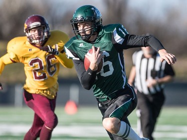 Holy Cross Crusaders quarterback Jonah Humphrey runs the ball against the LeBoldus Golden Suns during the high school football 4A provincial final at SMS field in Saskatoon, November 12, 2016.