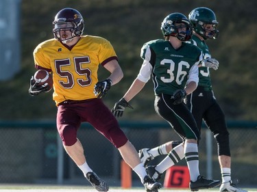 LeBoldus Golden Suns offensive linemen Ryder Varga grabs a pass for a touchdown against the Holy Cross Crusaders during the high school football 4A provincial final at SMS field in Saskatoon, November 12, 2016.