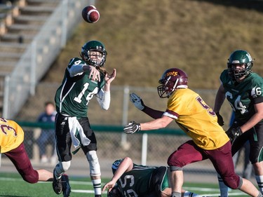 Holy Cross Crusaders quarterback Matthew Wilson throws a pass against the LeBoldus Golden Suns during the high school football 4A provincial final at SMS field in Saskatoon, November 12, 2016.