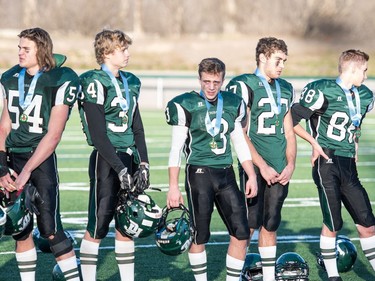 The Holy Cross Crusaders look on as the LeBoldus Golden Suns celebrate their victory during the high school football 4A provincial final at SMS field in Saskatoon, November 12, 2016.