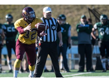 LeBoldus Golden Suns running back Adam Probe grabs a lateral pass against the Holy Cross Crusaders during the High school football 4A provincial final at SMS field in Saskatoon, SK. on Saturday, November 12, 2016. (LIAM RICHARDS/THE STAR PHOENIX)
