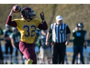 LeBoldus Golden Suns running back Adam Probe throws a touchdown pass after grabbing a lateral pass against the Holy Cross Crusaders during the High school football 4A provincial final at SMS field in Saskatoon, SK. on Saturday, November 12, 2016. (LIAM RICHARDS/THE STAR PHOENIX)