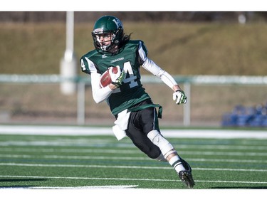 Holy Cross Crusaders quarter back Matthew Wilson runs the ball against the LeBoldus Golden Suns during the High school football 4A provincial final at SMS field in Saskatoon, SK. on Saturday, November 12, 2016. (LIAM RICHARDS/THE STAR PHOENIX)