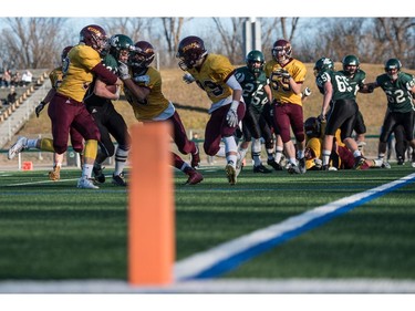 Holy Cross Crusaders receiver Dominie Gursky is stopped outside the goal line by the LeBoldus Golden Suns during the High school football 4A provincial final at SMS field in Saskatoon, SK. on Saturday, November 12, 2016. (LIAM RICHARDS/THE STAR PHOENIX)