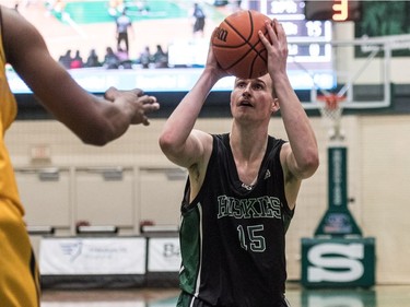 University of Saskatchewan Huskies forward Trevor Severinski takes a shot against the University of Brandon Bobcats in CIS Men's Basketball action at the PAC in Saskatoon, November 19, 2016.