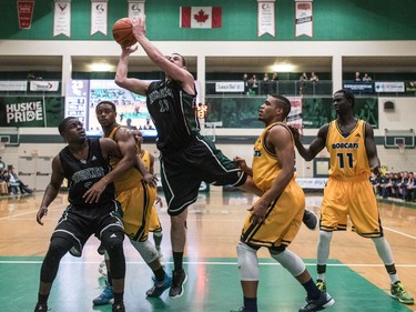 University of Saskatchewan Huskies forward Trevor Severinski takes a shot against the University of Brandon Bobcats in CIS Men's Basketball action at the PAC in Saskatoon, November 19, 2016.