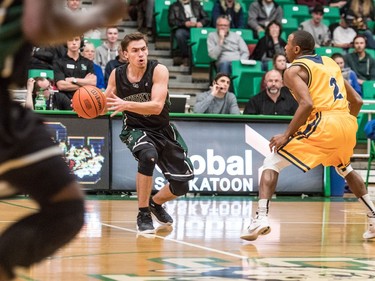 University of Saskatchewan Huskies guard Alex Ulruh passes the ball against the University of Brandon Bobcats in CIS Men's Basketball action at the PAC in Saskatoon, November 19, 2016.