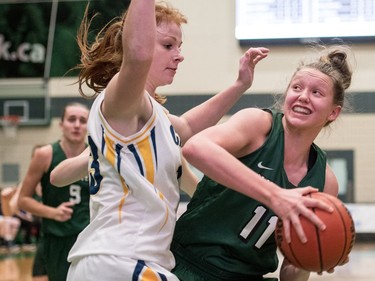 University of Saskatchewan Huskies forward #11 Summer Masikewich attempts a shot against University of Brandon Bobcats forward Amy Williams in CIS Women's Basketball action at the PAC in Saskatoon, November 19, 2016.