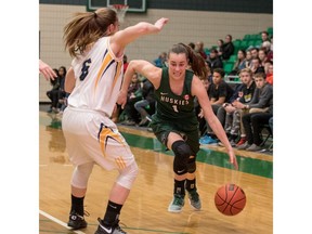 University of Saskatchewan Huskies guard Libby Epoch moves the ball against the University of Brandon Bobcats in CIS Women's Basketball action at the PAC in Saskatoon, November 19, 2016.