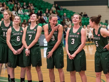 The University of Saskatchewan Huskies women's basketball team watches a video tribute to their championship win last year following a game against the University of Brandon Bobcats in CIS Women's Basketball action at the PAC in Saskatoon, November 19, 2016.