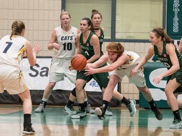 University of Brandon Bobcats forward Amy Williams passes the ball against the University of Saskatchewan Huskies in CIS Women's Basketball action at the PAC in Saskatoon, November 19, 2016.