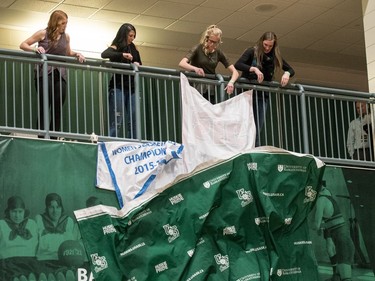 University of Saskatchewan Huskies women's basketball team alumni unveil their championship banners from last year's win following a game against the University of Brandon Bobcats in CIS Women's Basketball action at the PAC in Saskatoon, November 19, 2016.