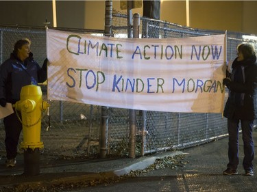 People attend a Stop Kinder Morgan Solidarity Vigil at the gates to Prairieland Park, hosted by Climate Justice Saskatoon, November 21, 2016.