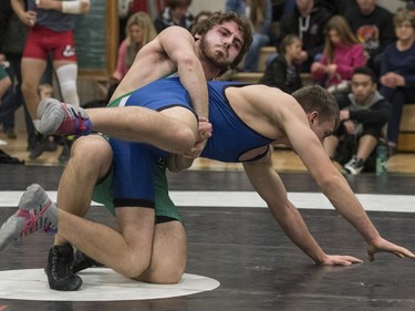 University of Saskatchewan Huskies wrestler Thomas Johnston takes on Cat Town Wrestling Club wrestler Jacon Hall during the Huskies Open wrestling at the Education Building on the U of S campus in Saskatoon, November 26, 2016.