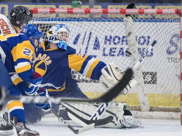 Saskatoon Blades goalie Logan Flodell reaches but cannot stop a shot from the Medicine Hat Tigers in first period WHL action in Saskatoon, November 26, 2016.