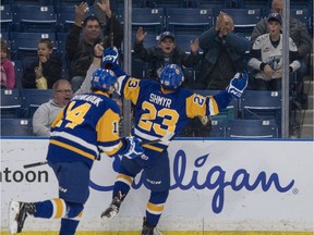 Saskatoon Blades left winger Braylon Shmyr celebrates a goal with fans against the Medicine Hat Tigers.