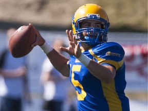 Saskatoon Hilltops quarterback Jared Andreychuk looks to throw a pass against the Regina Thunder at Saskatoon Minor Football Field in Saskatoon. LIAM RICHARDS/THE STAR PHOENIX)