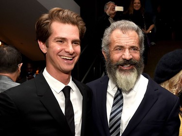 Actor Andrew Garfield (L) and director Mel Gibson pose at the after party for a screening of Summit Entertainment's "Hacksaw Ridge" at the Academy of Motion Picture Arts and Sciences on October 24, 2016 in Beverly Hills, California.