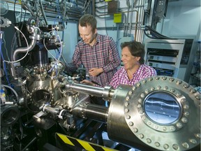 Professor Alexander Moewes (right) and Neil Johnson (left) study a new super-thin material using synchrotron light.