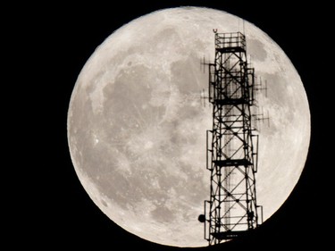 The moon rises behind a power line in Sarajevo, Bosnia, November 14, 2016. The brightest moon in almost 69 years, a phenomenon known as the supermoon, is lighting up the sky in a treat for star watchers around the globe.