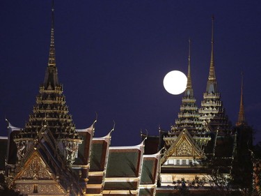 The moon rises over the Grand Palace in Bangkok, Thailand, November 14, 2016. The brightest moon in almost 69 years lights up the sky in a treat for star watchers around the globe.