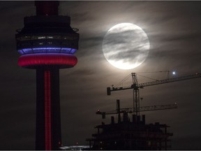 The super perigee full moon sets behind the CN tower in Toronto on Monday November 14, 2016. According to NASA, the so-called 'supermoon' will be the closest full moon to earth since 1948, and it won't be as close again until 2034.