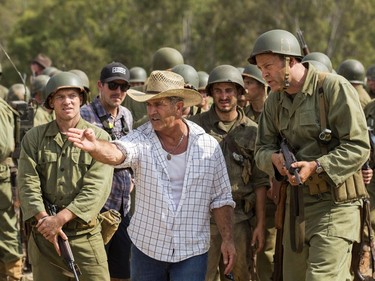 Director Mel Gibson (C) and actor Vince Vaughn (R) on the set of "Hacksaw Ridge."