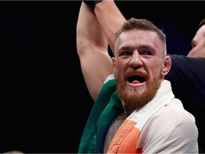 Conor McGregor celebrates his victory over Eddie Alvarez in their lightweight championship bout during the UFC 205 event at Madison Square Garden on November 12, 2016 in New York City.