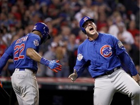 Anthony Rizzo #44 of the Chicago Cubs celebrates with Jason Heyward #22 after Rizzo scores a run in the 10th inning on a Miguel Montero #47 against the Cleveland Indians in Game Seven of the 2016 World Series at Progressive Field on November 2, 2016 in Cleveland, Ohio.