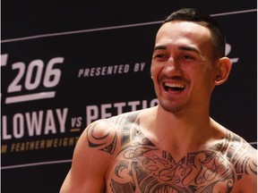 American featherweight fighter Max Holloway who will fight on the main card against Anthony Pettis at UFC206  this Saturday limbers up before a bit of sparring in Toronto on Wednesday December 7, 2016. Jack Boland/Toronto Sun/Postmedia Network