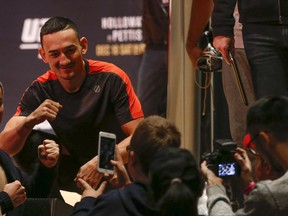 American featherweight fighter Max Holloway who will fight on the main card against Anthony Pettis at UFC206  this Saturday poses for photos before a bit of sparring in Toronto on Wednesday December 7, 2016. Jack Boland/Toronto Sun/Postmedia Network