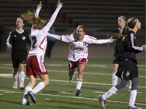 Centennial Chargers #14 McKenna Olson (C) celebrates a go-ahead goal with teammate #2 Shayla Lukey in a match against the St. Joseph Guardians during the city high school girls final from SMF Field, October 24, 2016.