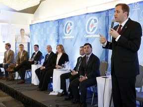 Conservative leadership candidate Brad Trost, right, responds to questions from the audience at a Conservative leadership debate.