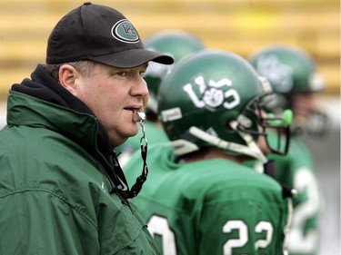 University of Saskatchewan Huskies' head coach Brian Towriss runs his team through drill during Vanier Cup practice at Ivor Wynne Stadium in Hamilton, Ont. on Friday, November 26, 2004. Towriss is stepping down after 33 years as the University of Saskatchewan's head football coach.