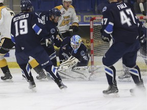 Logan Flodell attempts to save save a shot on net my a Wheat Kings player at SaskTel Centre in Saskatoon on Dec. 17, 2016.