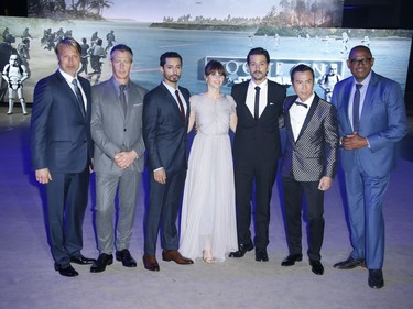 L-R: Actors Mads Mikkelsen, Ben Mendelsohn, Riz Ahmed, Felicity Jones, Diego Luna, Donnie Yen and Forest Whitaker pose for photographers upon arrival at the "Rogue One: A Star Wars Story" premiere in London, England, December 13, 2016.