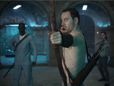 Michael K. Williams and Michael Fassbender star in "Assassin's Creed."