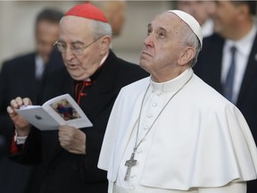 Pope Francis looks up at a statue of the Virgin Mary in downtown Rome, Thursday, Dec. 8, 2016, on occasion of the Immaculate Conception feast. Now, the