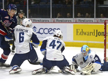 The Regina Pats and the Saskatoon Blades scramble in front of the Blades' net during a game at the Brandt Centre in Regina, December 10, 2016.