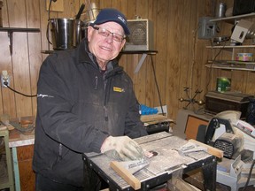 Ross Vollmer says he'd rather be in his workshop making holding crosses than in the coffee shop any day. Photo by Darlene Polachic