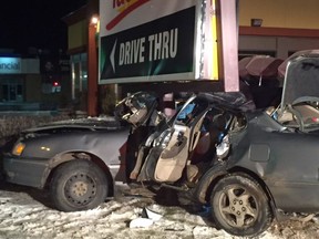 Saskatoon firefighters had to extract three people from a car after it crashed into a sign post near the intersection of Avenue F and 22nd Street in Saskatoon on Thursday, Dec. 29. 2016. (Supplied/Saskatoon Fire Department)