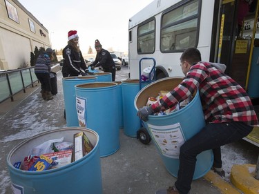 Dozens of bins that were set up around the city and in supporting businesses were filled with food for the Saskatoon Food Bank and Learning Centre during the annual CKOM/Co-op Christmas food drive, Stuff The Bus campaign. MD Ambulance volunteers were dropping off these bins that were loaded in a trailer, December 15, 2016.